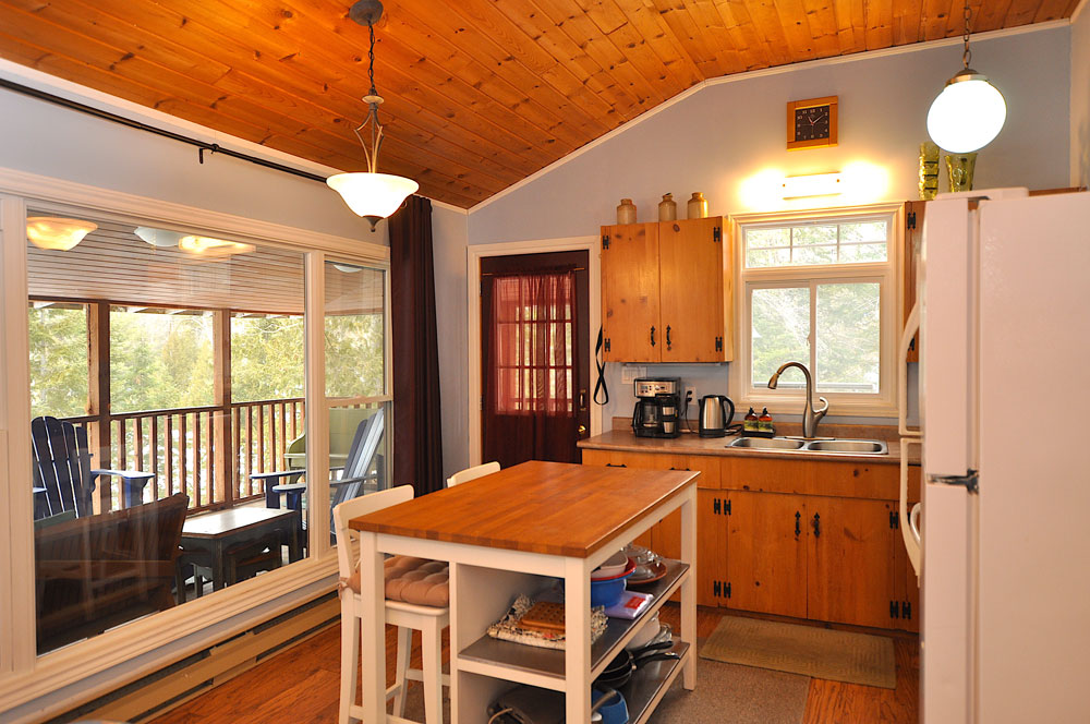 Haliburton Cottage - Gooderham Lake Into The Woods - Entrance-to-the-kitchen-view-to-the-screen-deck
