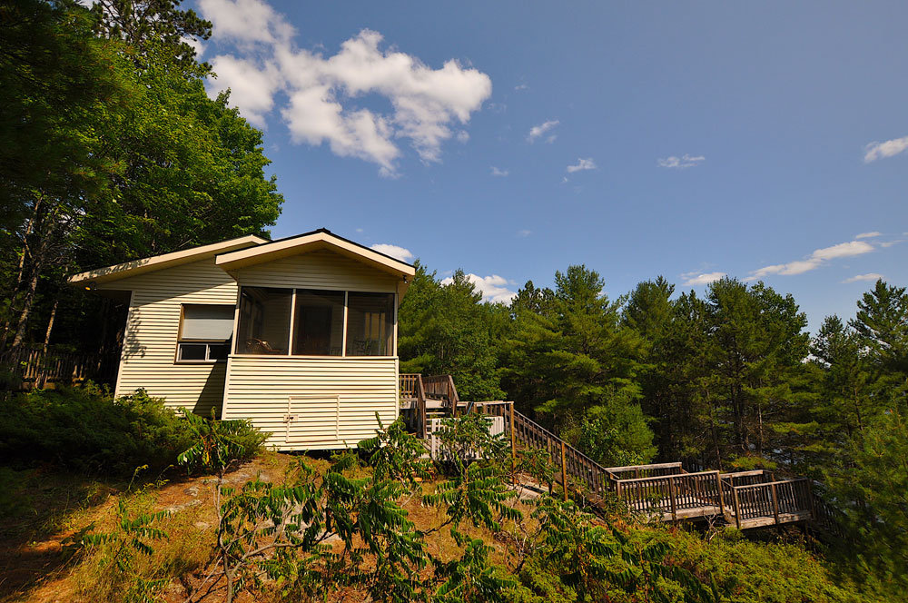 Haliburton Cottage - Koshlong Lake Driftwood Hill - View-from-the-side-of-the-sunroom-and-stairs